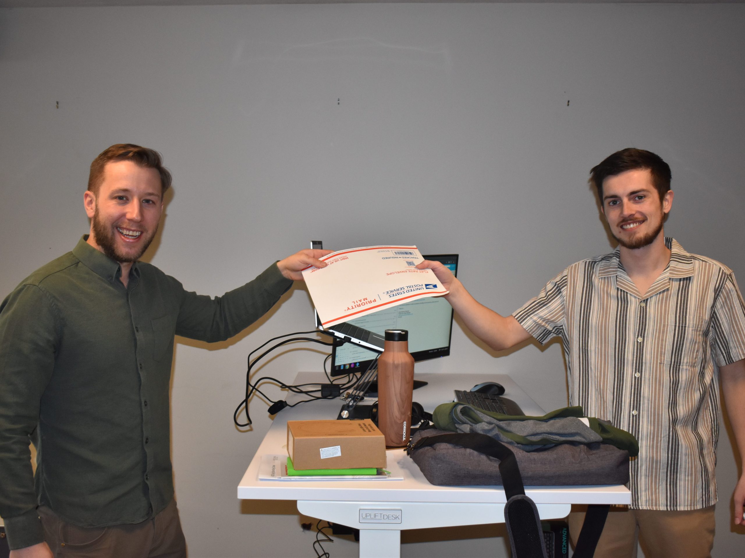 Photo of person handing mail to our staff.